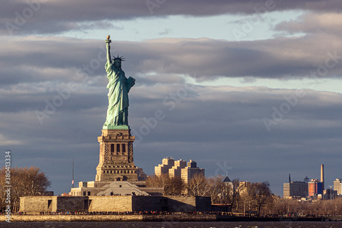 Statue of liberty at sunset. VIew from Staten Island Ferry