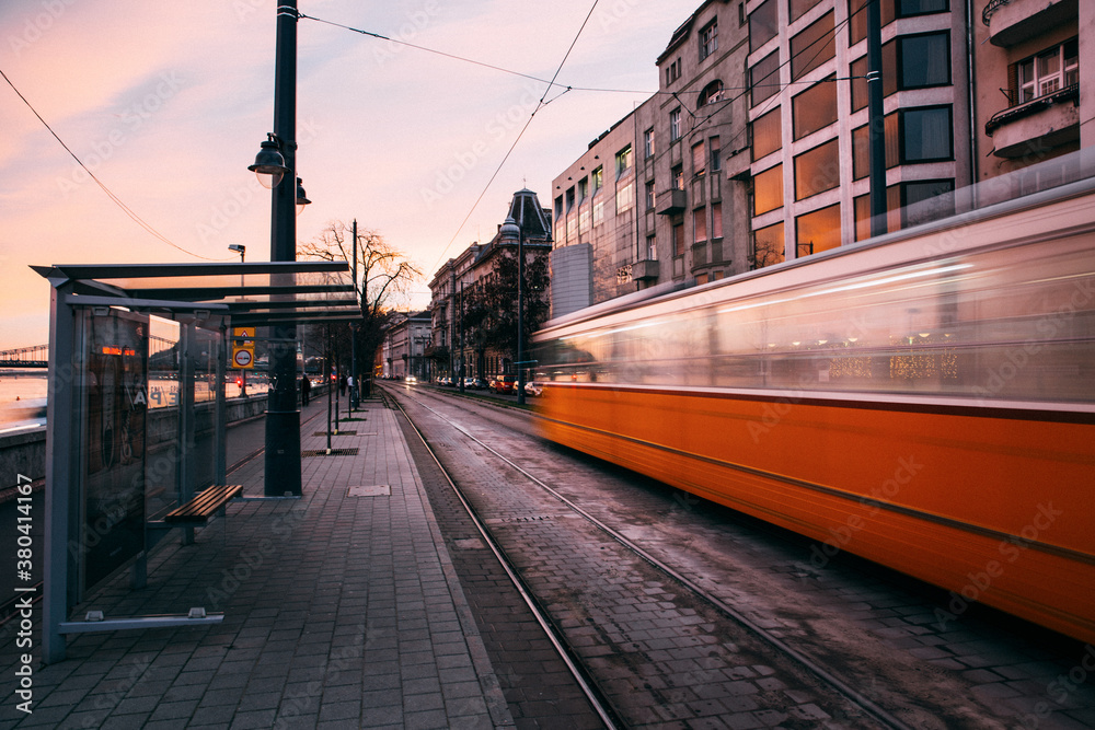Tram passing in a street Tram passing in a street