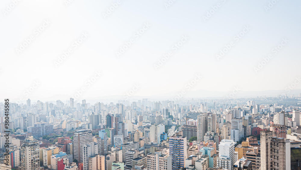 Urban aerial panorama of São Paulo in a sunny day with blue sky. View from Copan building.