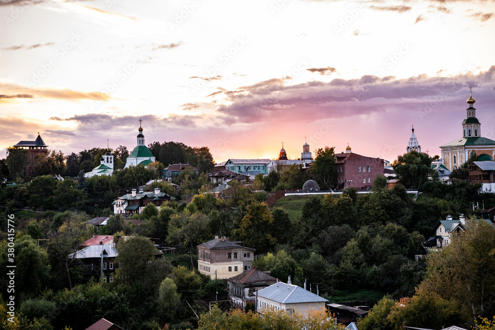 old white-stone temples against the backdrop of sunset