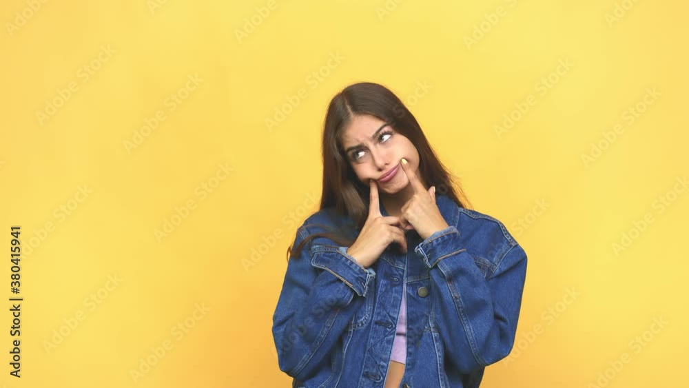 Young caucasian woman doubting between two options Young caucasian woman doubting between two options