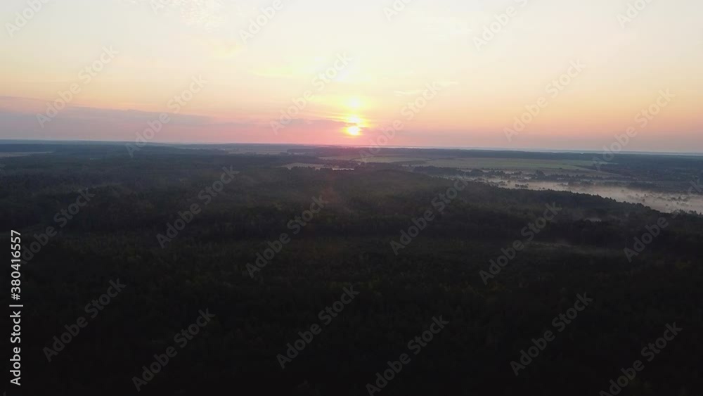 Smooth flight over the morning forest at sunrise in autumn Smooth flight over the morning forest at sunrise in autumn