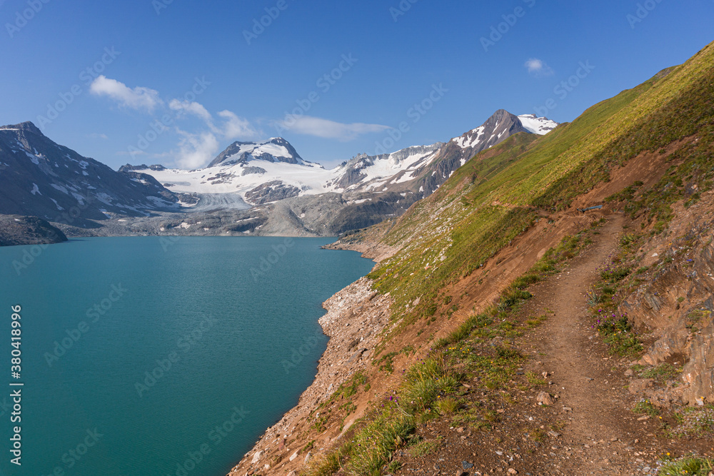 The lake of sabbioni, between the alps of the val formazza, during a summer day, near the town of Riale, Italy - July 2020.