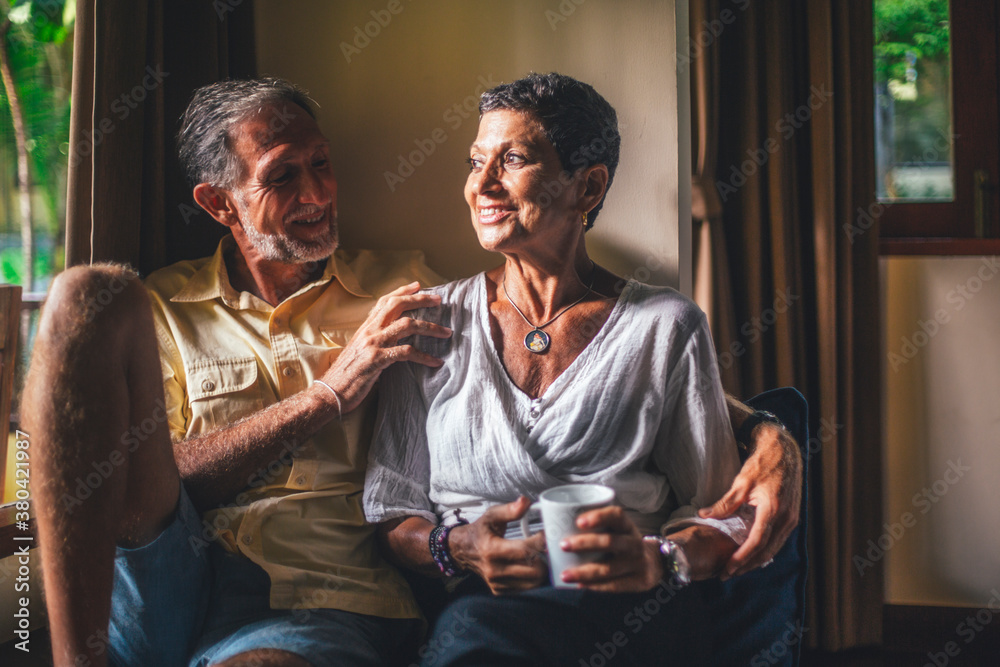 Senior Couple Relaxing in a Hotel Room Senior Couple Relaxing in a Hotel Room