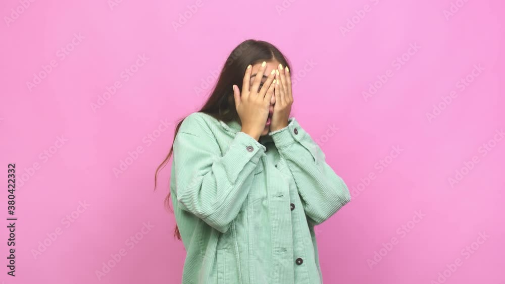 Young caucasian woman blink through fingers frightened and nervous Young caucasian woman blink through fingers frightened and nervous