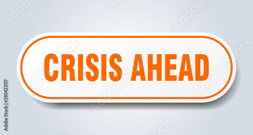 crisis ahead sign. rounded isolated button. white sticker