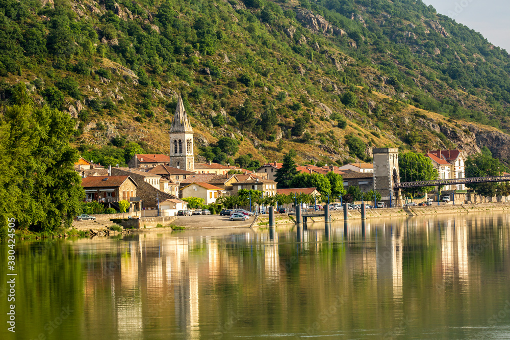 A bridge across tghe Rhone River and the commune of Andance, France