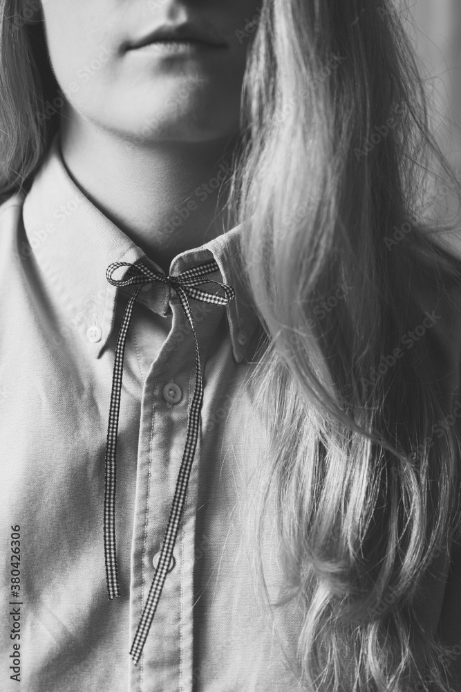 Black and white crop of young woman wearing a collared shirt with a ...