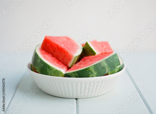 Fresh seedless watermelong on simple background