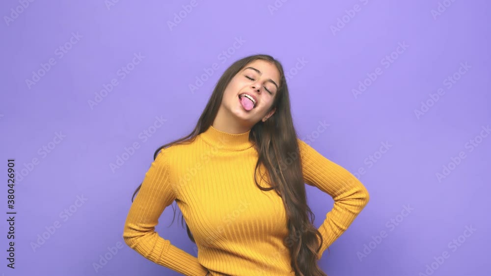 Young caucasian woman funny and friendly sticking out tongue Young caucasian woman funny and friendly sticking out tongue