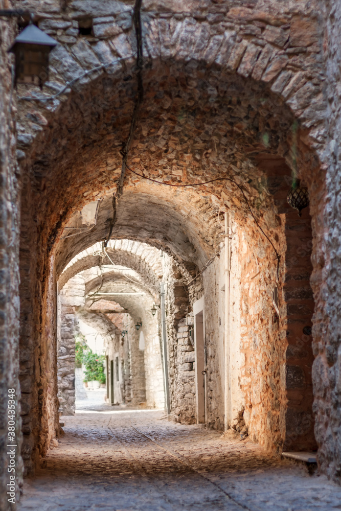 Narrow Street with Arches in a Medieval Village