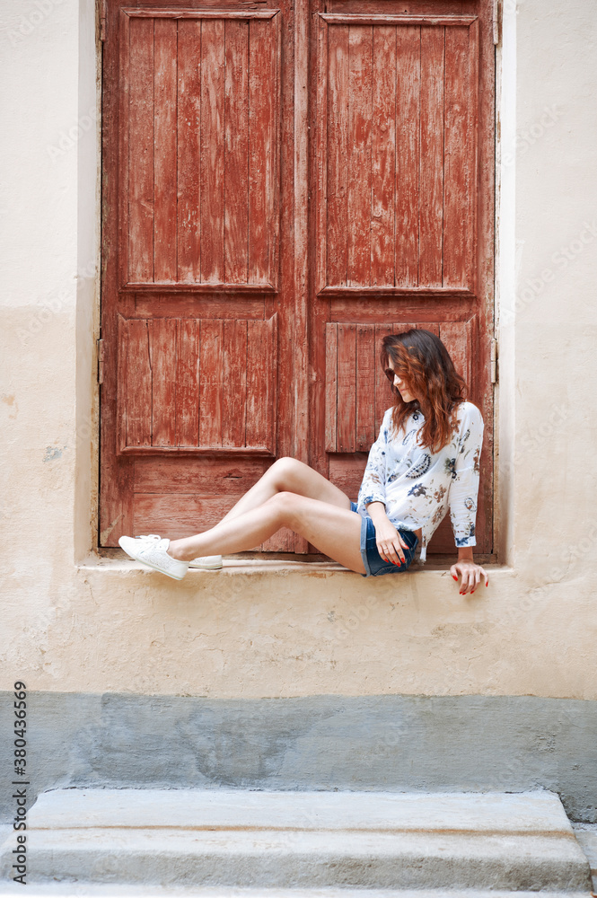 The girl at the window The girl at the window