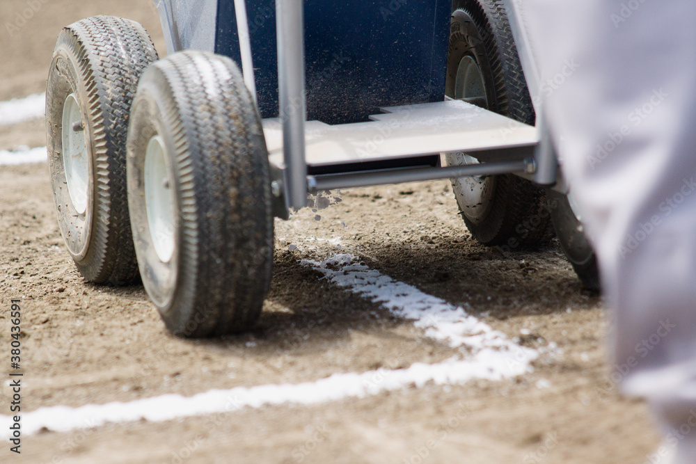 Chalking batting boxes on baseball infield Chalking batting boxes on baseball infield