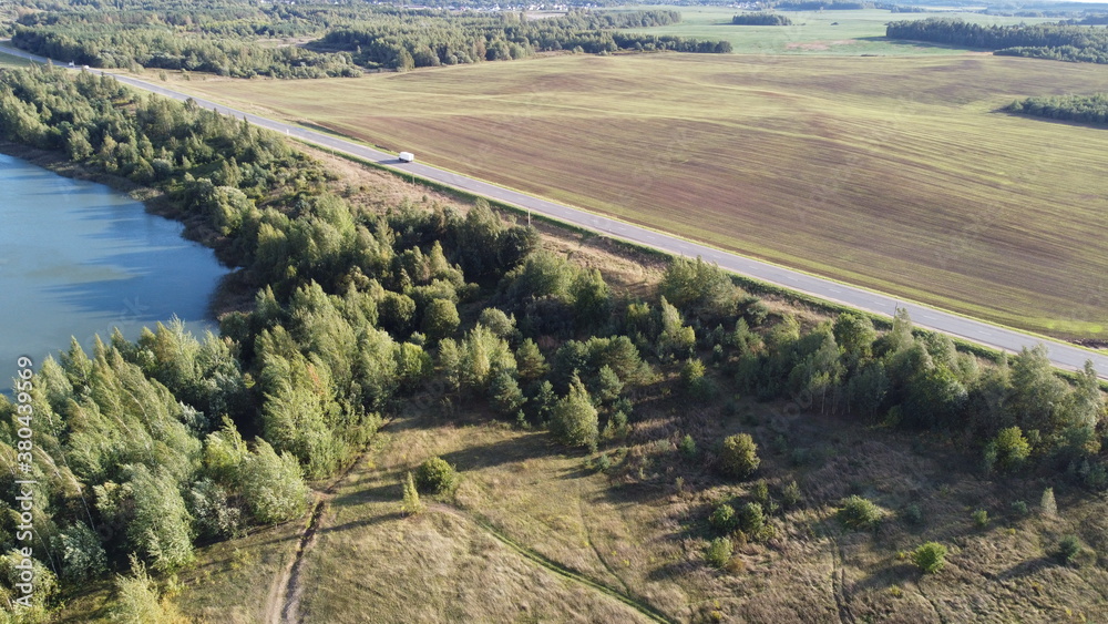 Top view of an asphalt road in the fields