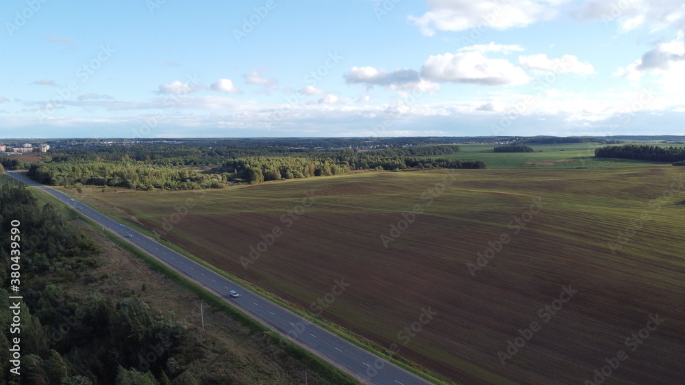 Top view of an asphalt road in the fields