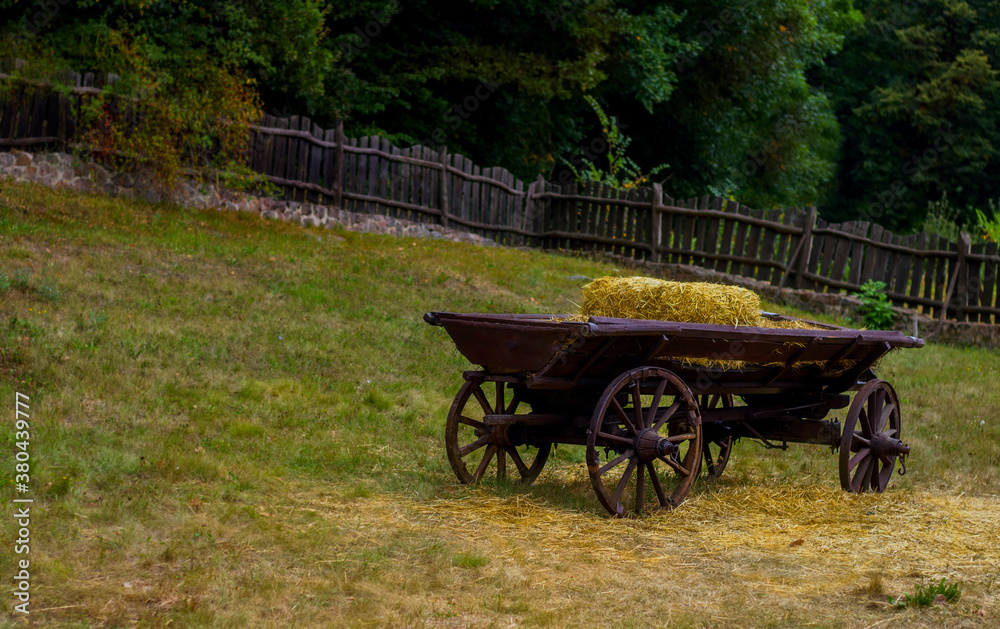 Straw on a wooden old cart