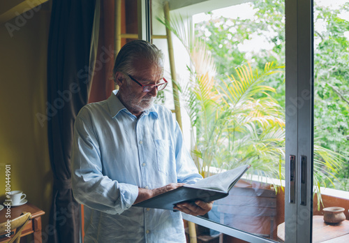 Senior Man Reading His Diary photo