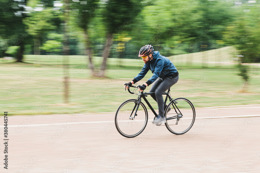 Motion blur of a biker in the park Motion blur of a biker in the park