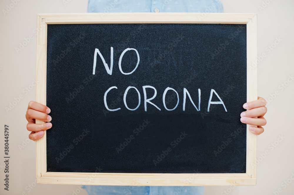 © AS Photo Family - No corona. Coronavirus concept. Boy hold inscription on the board. © AS Photo Family - No corona. Coronavirus concept. Boy hold inscription on the board.