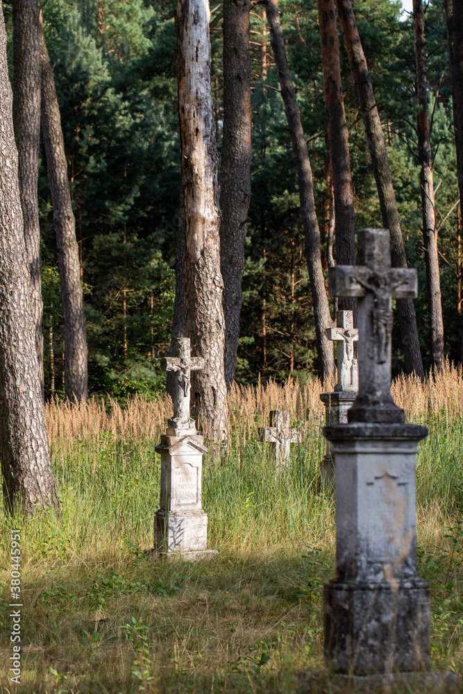 Old stone cross in the cemetery. Old Ukrainian cemetery in Gorajec. Old stone cross in the cemetery. Old Ukrainian cemetery in Gorajec.
