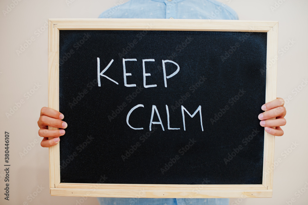 © AS Photo Family - Keep calm. Coronavirus concept. Boy hold inscription on the board. © AS Photo Family - Keep calm. Coronavirus concept. Boy hold inscription on the board.