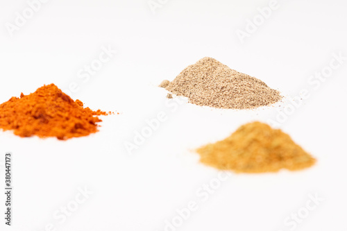 Indian spices selection over dark wooden table. Food or spicy cooking concept, Healthy eating Background.