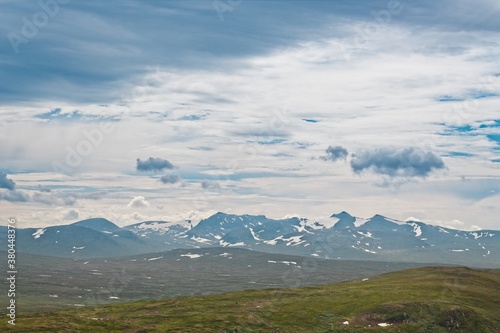 Storulvån (Sweden). View of partially snow-capped mountain peaks. photo