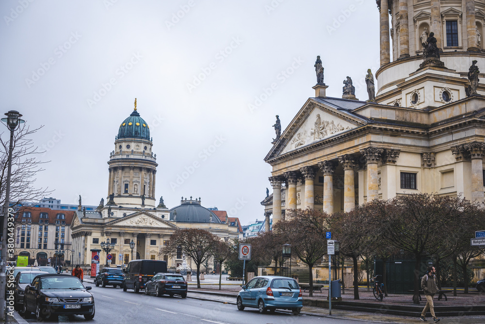 street photo with interesting architectural structures and houses and a church. street walk in Berlin