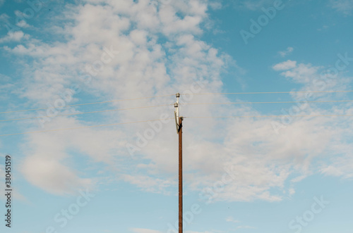 Power line against blue skies