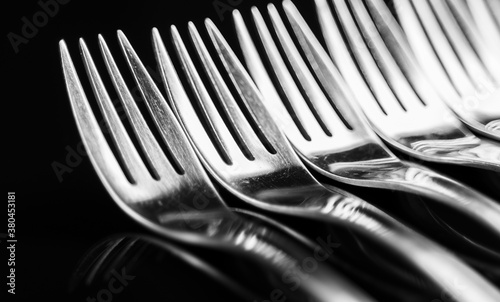 Composition made of forks on the black background.