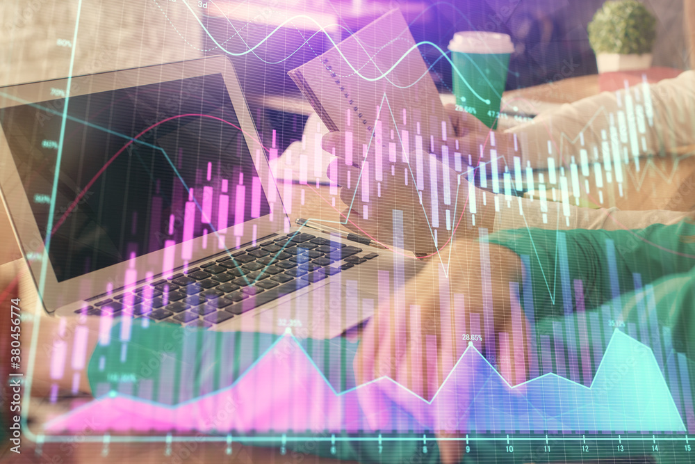 Double exposure of man and woman working together and forex chart hologram. Business concept. Computer background. Double exposure of man and woman working together and forex chart hologram. Business concept. Computer background.