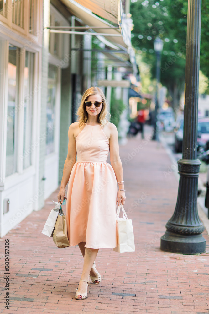 Beautiful woman in a dress out shopping Beautiful woman in a dress out shopping