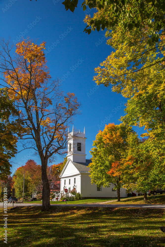 The Congregational church in Peru, Vermont.  Surrounding trees are showing brilliant fall color.