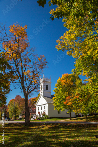 The Congregational church in Peru, Vermont.  Surrounding trees are showing brilliant fall color.