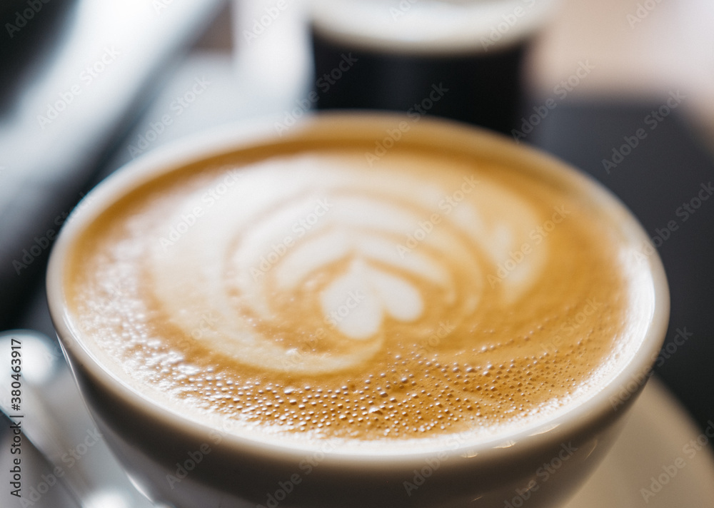 Morning latte coffee poured in modern cafe Morning latte coffee poured in modern cafe