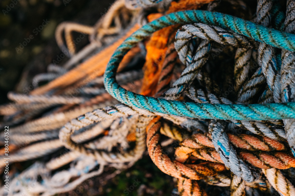 pile of knotted rope on beach pile of knotted rope on beach