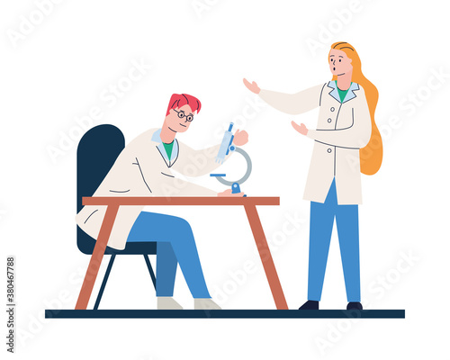 young doctors couple with microscope