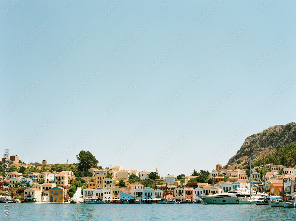 View of harbour the many coloured houses in the bay at Kastellorizo View of harbour the many coloured houses in the bay at Kastellorizo