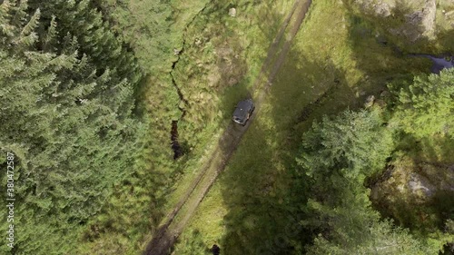 ATV All Terrain Vehicle Driving Through a Forest photo