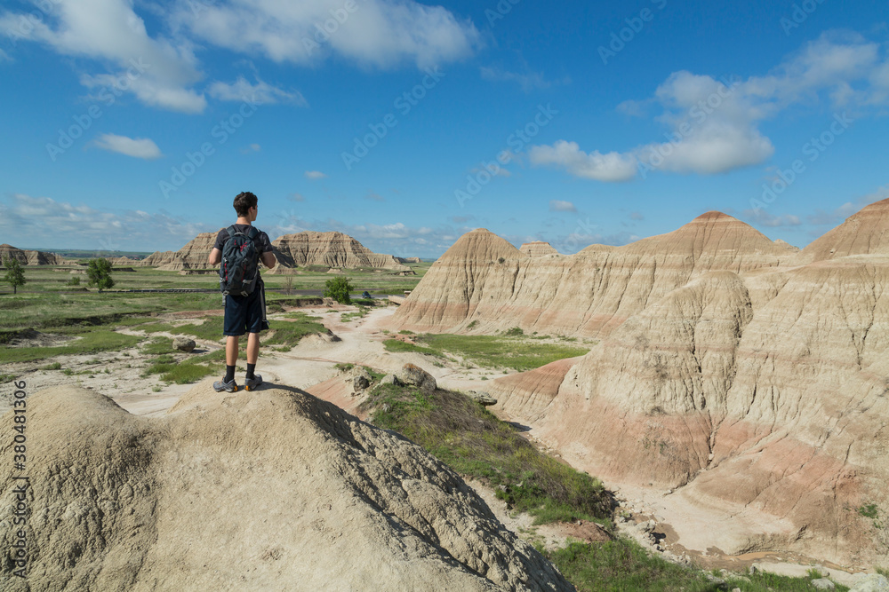 Hiker looking at the vast rock formations Hiker looking at the vast rock formations