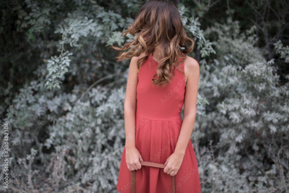 Young beautiful woman in orange dress outdoors Young beautiful woman in orange dress outdoors
