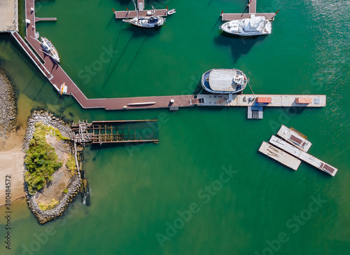 Aerial view by small group of sail boats in a marina