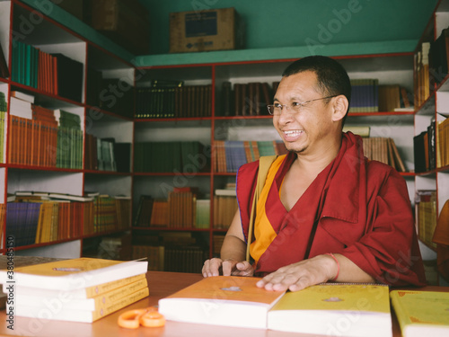 Happy Monk Book Seller in front of his Library photo