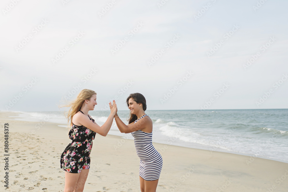 Friends giving high fives Friends giving high fives