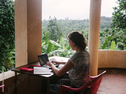 Girl who Works from anywhere, like in jungle photo