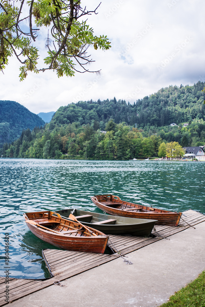 Lonely boats floating on lake Bled Lonely boats floating on lake Bled