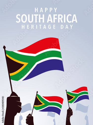 happy South African heritage day, hands holding flags of South Africa