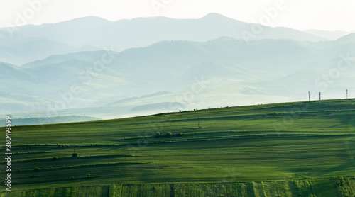Landscape of hills and cultivated green land