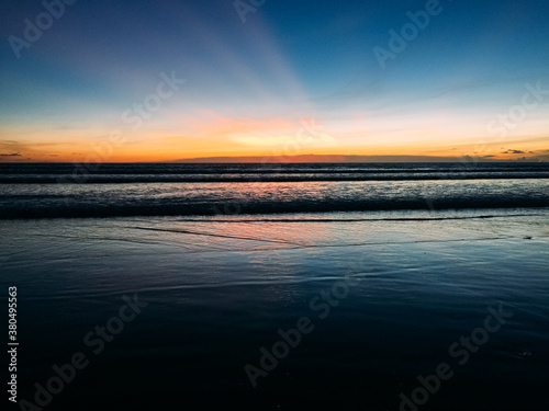 A beautiful sunset in an indonesian beach photo