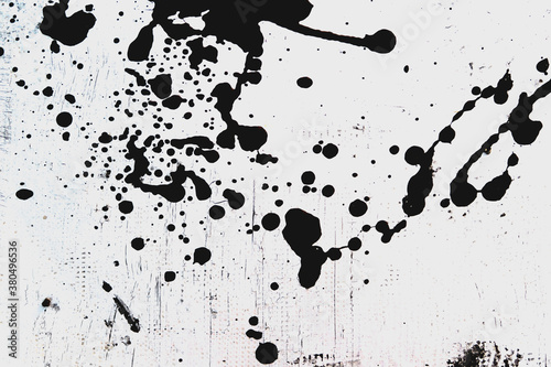 black paint splash on white background photo